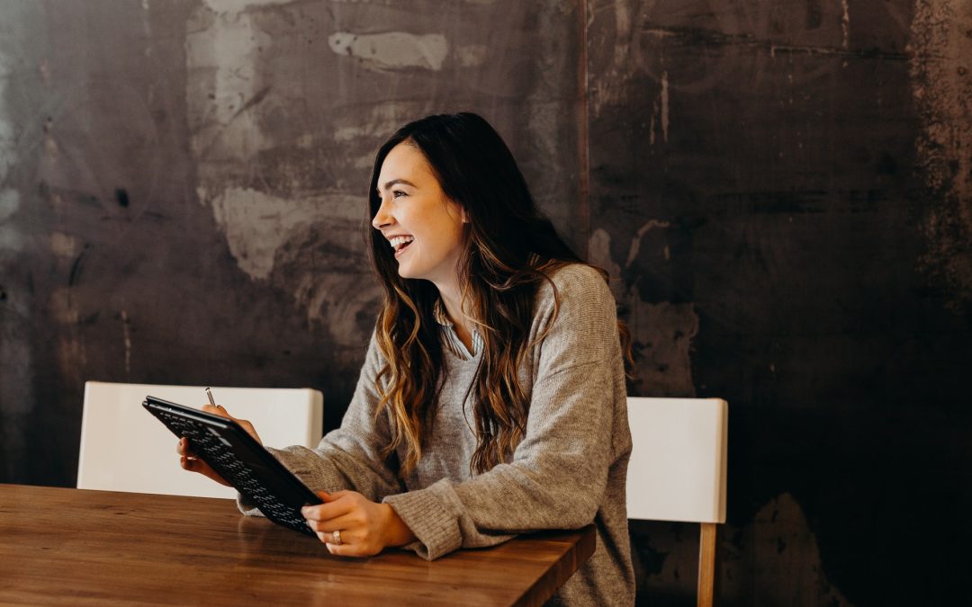 Woman with a small business smiling