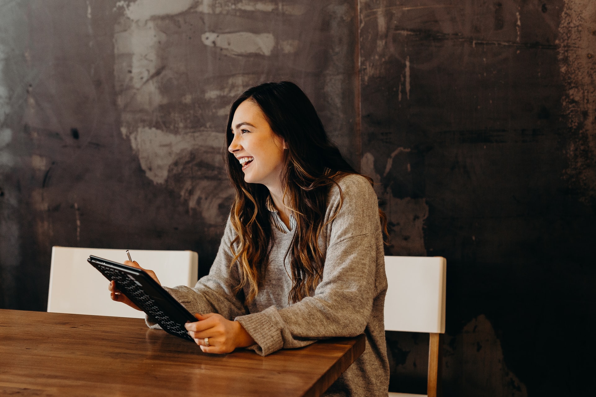 Woman with a small business smiling